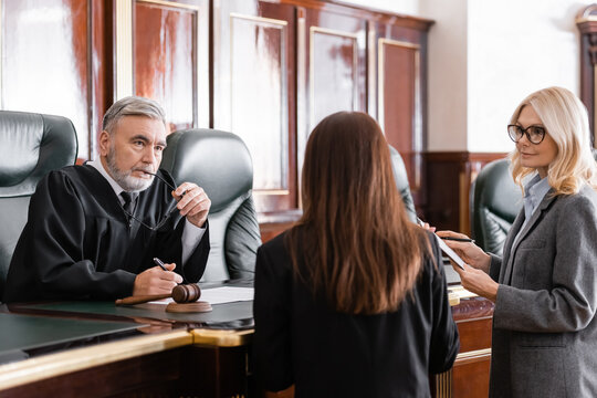 judge and two lawyers in court